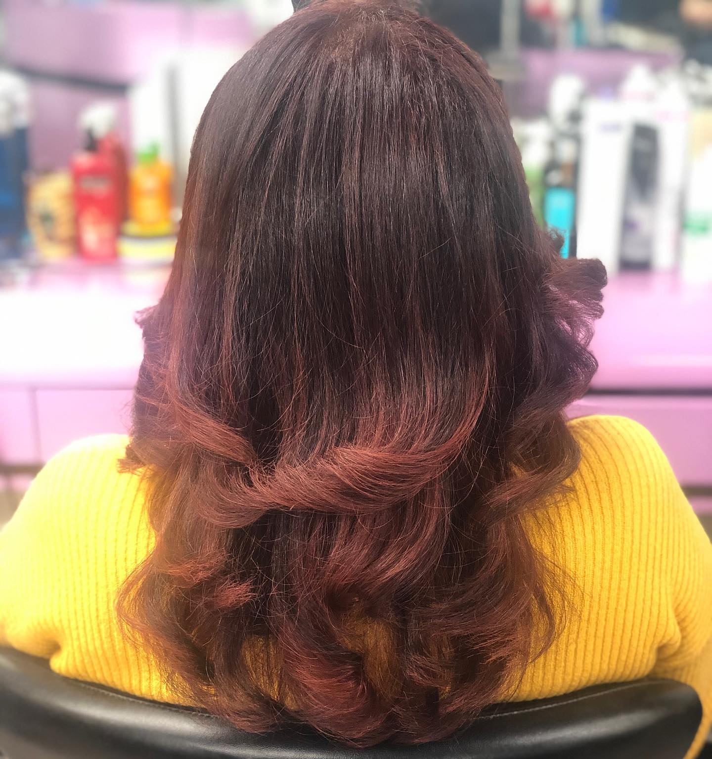 Back view of auburn hair with loose curls.